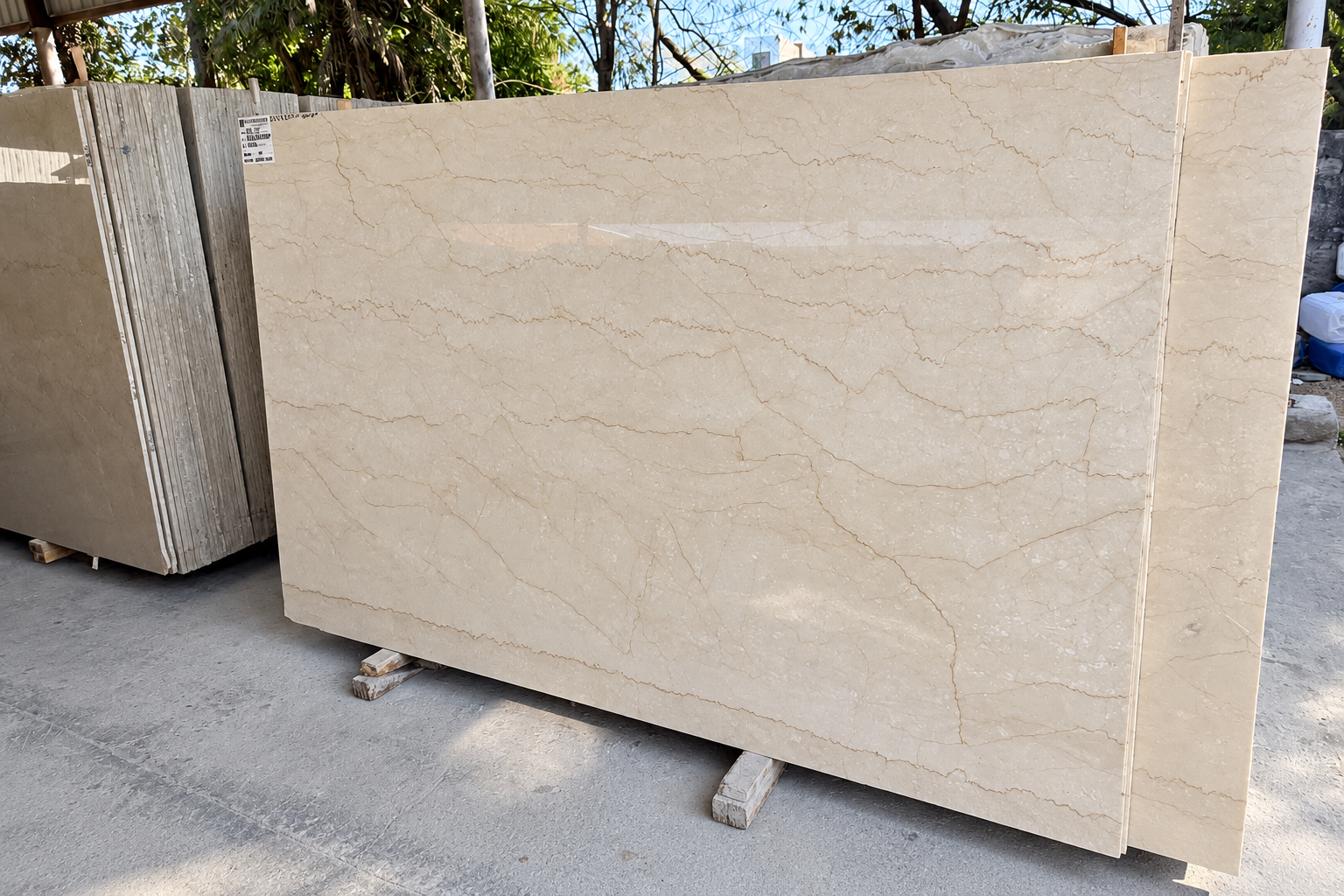 Polished beige Italian marble slab displayed for full-scale selection